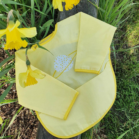 Ekologisk babyhaklapp med ärmar Yellow Planet